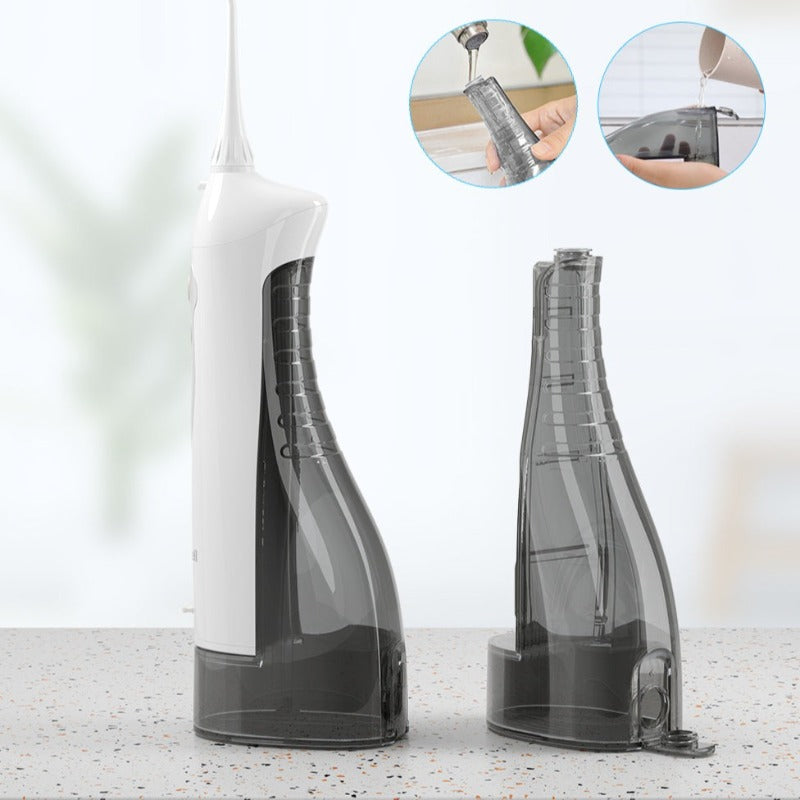Irrigateur buccal à pression variable avec réservoir d'eau